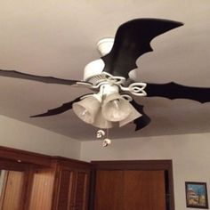 a black and white ceiling fan in a bedroom