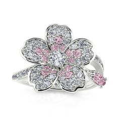 Fresh and feminine, this shimmering flower ring is sweet as can be. Crafted in sterling silver, this girly design features a round cut white center stone surrounded by a vibrant petal frame of dazzling bright pink and white stones. Destined to be adored, this charming ring is buffed to a brilliant luster.Carat Weight: 2.273 ctStone Size: 0.8,1.2,1.5,3,1.2,1.5,2*3 mmStone Type: Jeulia® StoneNumber of Stones: 77 Stone Color: Diamond White, Fancy PinkStone Shape: Round, OvalWeight: 3.33 gMaterial: Fancy P, Artistic Earrings, Jewelry Gift Ideas, Girly Design, White Stones, Presents For Her, Classy Jewelry, Fancy Jewelry, Pretty Rings