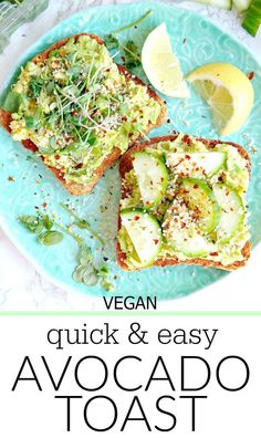 an avocado toast on a blue plate with lemon wedges