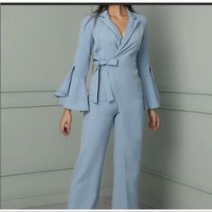 Blue Jumpsuit, Wide Leg, Never Worn, New With Tags. Size Medium, Fits Between A 2-4. Spring Party Blue Suits, Blue Summer Party Suit, Light Blue V-neck Jumpsuit For Party, Blue Fitted Jumpsuits And Rompers For Work, Light Blue Fitted V-neck Jumpsuits And Rompers, Chic Blue V-neck Pantsuit, Fitted Light Blue V-neck Jumpsuits And Rompers, Chic Fitted Light Blue Jumpsuits And Rompers, Chic Light Blue Fitted Jumpsuits And Rompers