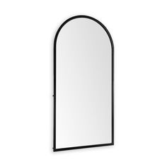 an arched mirror is shown against a white wall