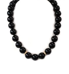 "Hallmark: 14k Material: 14k yellow gold Diamond: 15 points Gemstone: onyx beads (13.5mm - 13.8mm) Measurements: 15.5\" long x 13.8mm Weight: 94.9 grams This is an elegant beaded necklace. It features a single strand with high polished onyx beads 3.5-3.8mm in size. The center of the necklace has two 14k yellow gold ring between the beads and it has round cut sparkling diamonds. The yellow gold clasp is a long floral filigree design with a hook and push in closure. It has the 14k metal content st Formal Black Jewelry With Gemstone Beads, Formal Black Gemstone Beads Jewelry, Formal Black Jewelry With Large Beads, Onyx Bead Necklace With 8mm Round Beads, Black Round Jewelry With Large Beads, Black Onyx Round Bead Necklace, Hand-strung Onyx Beaded Necklace With Round Beads, Luxury Onyx Necklace With Faceted Beads, Luxury Onyx 8mm Beads Jewelry