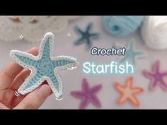 crochet starfish brooch in the palm of someone's hand