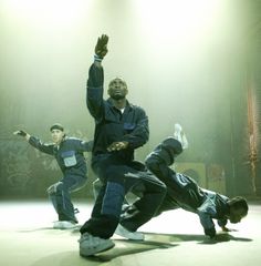 a group of men standing on top of a stage