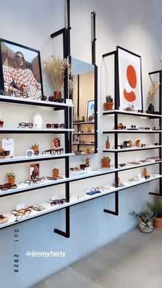 the shelves are filled with various items on display for sale at the store's front window