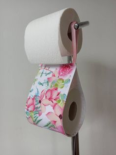 a roll of toilet paper hanging from a metal holder