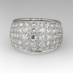 This wonderful domed ring is accented with seventy-five (75), bead set, round brilliant/single cut diamonds. The ring measures 13.7mm at the top, rises 5.9mm above the finger, tapering to 4.8mm wide and 1.0mm thick at the base of the shank. This ring is currently a size 6.5 and resizing is not recommended. Elegant White Gold Dome Ring With Brilliant Cut, Elegant Diamond Dome Ring With Brilliant Cut, Elegant Dome Ring With Brilliant Cut Diamond, Timeless White Gold Dome Ring With Diamond, White Diamond Dome Ring For Formal Occasions, White Gold Dome Ring With Polished Diamond, Luxury Wide Band Diamond Ring With Diamond Cut, Timeless Dome Ring In White Gold With Diamond Accents, White Gold Dome Ring With Diamond