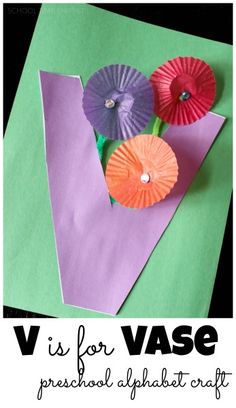 paper flowers are placed on top of a piece of paper with the words v is for vase preschool alphabet craft