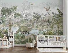 a baby's room with dinosaurs and plants on the wall, along with a crib