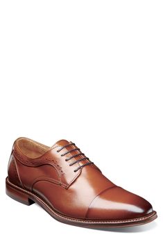 Broguing and burnished details accent a round cap toe lace-up that features anatomical arch support. Round cap toe Broguing details Lace-up Arch support removable insole Leather upper, manmade sole Imported Fitted Derby With Rubber Heel Cap And Cap Toe, Fitted Cap Toe Derby With Rubber Heel Cap, Classic Fitted Lace-up Oxfords, Fitted Derby With Rubber Heel Cap And Plain Toe, Elegant Fitted Dress Shoes With Cushioned Footbed, Fitted Oxford Shoes With Cushioned Footbed And Plain Toe, Fitted Cushioned Oxfords With Plain Toe, Fitted Plain Toe Oxfords With Cushioned Footbed, Classic Fitted Dress Shoes With Cushioned Footbed