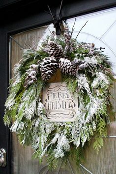 a christmas wreath hanging on the front door