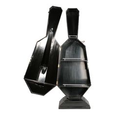 two black vases sitting next to each other