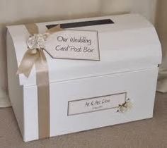 a wedding card box with a ribbon and bow