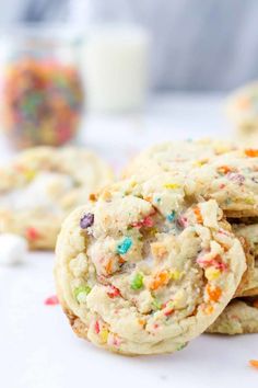 white chocolate chip cookies with sprinkles stacked on top of each other