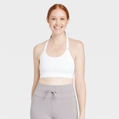 Why we're ALL IN: Get the right support as you practice yoga or exercise by wearing this seamless cami medium-support sports bra. The soft and stretchy fabric make this midline bra comfortable to wear, while the pull-on style allow easy on and off. Plus, you'll enjoy customized coverage with the removable cups and adjustable straps. All in Motion™: Made for every move, priced for every day. White Athleisure Bra For Light Exercise, White Light Support Bra For Light Exercise, Sports Bra With Medium Bust Support For Workout, Sports Bra With Medium Bust Support In Seamless Fabric, White Seamless Sports Bra For Light Sports, Athleisure Activewear With Medium Bust Support, Racerback Bra With Medium Support For Light Exercise, Medium Support Racerback Bra For Light Exercise, Supportive Seamless Functional Sports Bra