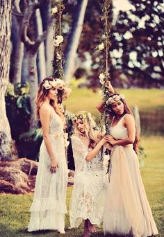 three women in white dresses standing next to each other with flowers on their head and the caption ca - love this look for bridal party