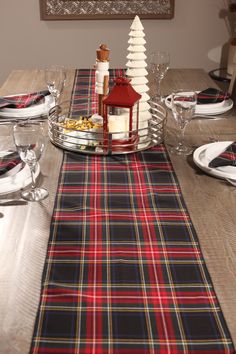 Add elegance and festive flair to your décor with our Black Stewart tartan table runner. Perfect for formal dining or as a striking mantle accent, its rich blend of black, red, and gold creates a timeless look that’s ideal for the holiday season or New Year’s celebrations. Whether setting the tone for a sophisticated dinner or enhancing your seasonal decorations, this table runner brings warmth, tradition, and style to any space. The tartan table runner is made of polyviscose fabric with a coord Air Force Families, Black Tartan, Canadian Maple Leaf, Stewart Tartan, Western Canada, Tartan Fabric, Seasonal Decorations, Tartan Dress, Prince Edward Island