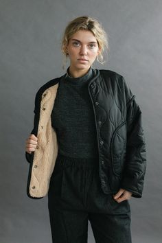 The Anouk Jacket is an elevated take on a liner style jacket featuring a quilted nylon outer body and cozy sherpa fleece lining. Roomy pockets and snap front closure. Oversized fit. Model is wearing SMALL. Model is 5'8". Please review our size guide prior to ordering. Need specific measurements? Send us an email and we will be happy to help you find the perfect fit. Everyday Winter Quilted Jacket With Pockets, Black Sherpa Outerwear, Winter Quilted Utility Outerwear, Everyday Fleece-lined Outerwear For Fall, Quilted Utility Jacket For Winter, Winter Utility Outerwear For Everyday, Utility Style Winter Outerwear For Everyday, Cozy Black Outerwear With Button Closure, Oversized Quilted Outerwear For Cold Weather