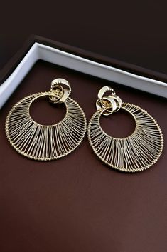 Elevate your style with our Metal Hollow Large Circle Earrings. These striking earrings feature intricate metalwork in a bold circular design, adding a touch of elegance to your look. Crafted with high-quality materials, they not only enhance your allure but also exude sophistication. Perfect for formal occasions, cocktail parties, or when you want to make a statement with your outfit, these earrings are the ideal choice to complement your ensemble with a touch of contemporary charm. Gold Alloy Hoop Earrings, Gold Hoop Earrings In Alloy, Elegant Circular Metal Earrings, Elegant Circle Metal Earrings, Metal Hoop Earrings For Parties, Circular Metal Party Earrings, Alloy Drop Hoop Earrings, Metal Circle Hoop Earrings, Hoop-shape Metal Clip-on Earrings For Party