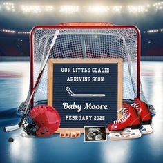 an ice hockey goalie's gear sits in front of a sign that says, our little goalie arriving soon baby moore february 25