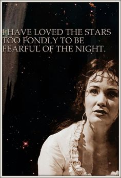 a woman with her hand on her chest in front of stars