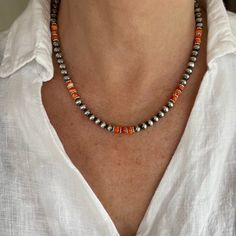 "The breathtaking beauty of this piece is sure to command many sincere compliments. It is crafted with AAA Grade 6mm all natural AAA grade orange spiny oyster beads and sterling silver Native American Navajo Pearls. The southwestern inspired design is a carefully crafted blend of materials and color that will add personality to your casual or formal dress. We promise that you will love and treasure this necklace as a welcomed addition to your life. - Not dyed, treated or color enhanced. 100% nat Artisan Multicolor Jewelry With 8mm Beads, Southwestern Orange Beaded Necklaces With Round Beads, Silver Southwestern Beaded Necklace As A Gift, Southwestern Orange Beaded Necklace With Round Beads, Bohemian Heishi Beads Jewelry With 8mm Beads, Southwestern Jewelry With Colorful Beads For Gifts, Southwestern Style Colorful Beads Jewelry For Gifts, Southwestern Style Colorful Beads Jewelry Gift, Southwestern Style Colorful Beaded Jewelry For Gifts