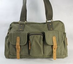 "Product important information External dimension: 18 * 11.5 * 5\"; weight 1.9 lbs., no shoulder strap Top lift handle, carry by hand or shoulder, quick and go Internal zipper pocket and phone holder; 3 front pockets; back pocket Art panel design Vintage brass fitting hardware; 16oz durable thick canvas Free Engrave Option on Selected Items. ---------------------------------------------- About the engraved details 1 * Note: this model can be engraved on the large leather panel on the front pocke Green Shoulder Bag With Luggage Sleeve For Daily Use, Olive Travel Bag With Pockets, Large Capacity Olive Shoulder Bag For Travel, Olive Large Capacity Shoulder Bag For Travel, Olive Shoulder Bag With Pockets For Daily Use, Olive Travel Satchel Shoulder Bag, Olive Shoulder Bag With Adjustable Strap For Travel, Olive Shoulder Bag Satchel For Travel, Olive Rectangular Shoulder Bag For Travel