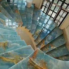 a spiral staircase made out of blue marble