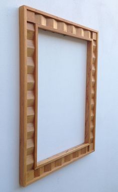 a wooden frame hanging on the wall