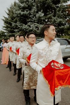 a group of men standing next to each other