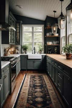 a kitchen filled with lots of counter top space next to a white sink and oven