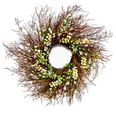 a brown wreath with white and pink flowers