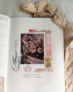 an open book with pictures and flowers on it