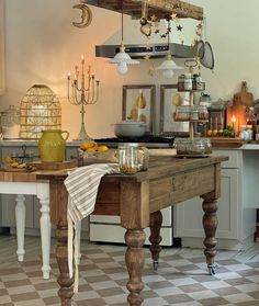 a kitchen with a table and some candles on it