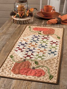 a table runner with pumpkins on it