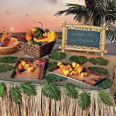 a table topped with plates and bowls filled with fruit