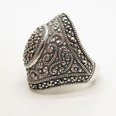 925 Sterling Silver Vintage Real Marcasite Gemstone Ring Size 7 Weight: 10.3g WELCOME TO PAWN SHOP We are an actual pawn shop and have been in business for over 25 years. Since 1990, our establishment has been serving a variety of clients by providing them with short term cash solutions and options of liquidity regarding their treasured heirlooms. Acknowledging that today′s customers are very sophisticated and are looking for a variety of investments, our acquisitions are hand-picked for our spe Silver Dome Ring With Gemstone For Anniversary, Classic Marcasite Jewelry For Anniversary, Marcasite Gemstone Ring For Anniversary, Marcasite Ring For Anniversary, Antique Silver Dome Ring As Gift, Marcasite Ring Stamped 925, Marcasite Anniversary Rings Stamped 925, Vintage Marcasite Ring Stamped 925, Silver Marcasite Ring With Gemstone