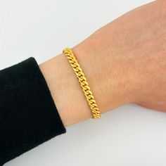 My popular 5mm Miami Cuban link bracelets are now available in solid 22k gold! This Cuban Link bracelet features solid gold links that are perfect for everyday wear and rocking that luxurious look. These Miami Cuban bracelets are also available in (SOLID) 14k yellow gold, 14k white gold, 14k rose gold, 18k yellow gold, and 22k gold! Mour & Co. is a reputable jewelry company that has been in the jewelry industry for MANY years. I deeply value all of my clients, therefore, I only provide you with the highest-quality jewelry and phenomenal customer service. All of my jewelry is crafted from real, genuine solid gold so it can be enjoyed for a lifetime without fading, tarnishing, or turning green. Orders are fulfilled within 1-2 business days ensuring a fast delivery--YOUR happiness is MY happi Classic 22k Yellow Gold Bracelets, Classic 22k Yellow Gold Bracelet, Classic 22k Gold Bracelets For Formal Occasions, Classic 22k Gold Bracelet For Formal Occasions, Luxury Gold Cuban Link Bracelet For Everyday, Classic 22k Gold Bracelets As A Gift, Gold Minimalist Cuban Link Bracelet For Formal Wear, Classic 22k Gold Bracelet As A Gift, Gold Minimalist Cuban Link Bracelet For Formal Occasions