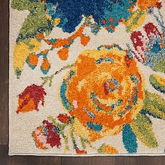 an area rug with colorful flowers on it