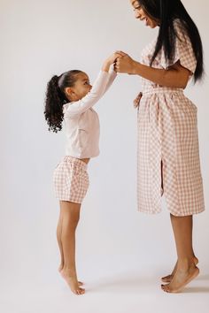 Our Women’s Caftan is ready to go from pool to beach. Designed with a relaxed fit in lightweight, woven organic cotton, it matches your mini’s One-Piece, Dress, Bloomers, or Shorts. A Mommy-and-me favorite that can be styled so many ways, wear it as a cover up, a dress with or without a belt, or, for our Coastal Stripe with buttons, open like a shirt jacket. 100% Woven Organic Cotton Ethically Made Ladies Caftan, Toddler Hat, Caftan Dress, Pretty Pastel, Mommy And Me, Fitted Dress, Blue Stripes, Warm Weather, Toddler Outfits