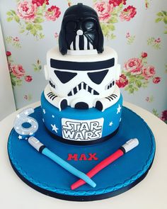 a star wars themed cake with a darth vader helmet on top