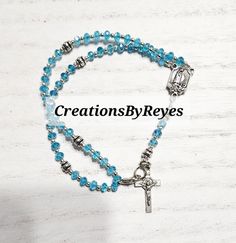 Wear a full rosary on your wrist! Choose your favorite color! Measures 7 1/2 inches, beautiful beaded bracelet for any gift occasion. If your favorite color isn't listed, please feel free to send me a message and I will gladly search for the closest match possible! All orders are made to order, 5 to 7 processing buisness days. Affordable Nickel-free Rosary Bracelet For Gifting, Cheap Bohemian Rosary Bracelet Gift, Gift Rosary Bracelet With Faceted Round Beads, Spiritual Rosary Bracelet With Faceted Beads As Gift, Beaded Cross Rosary Bracelet For Gift, Beaded Cross Rosary Bracelet Gift, Gift Beaded Cross Rosary Bracelet, Adjustable Beaded Cross Rosary Bracelet, Cross-shaped Rosary Bracelet With 8mm Beads