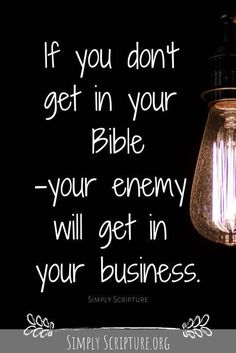 a light bulb hanging from the ceiling with a quote on it that says if you don't get in your bible, your enemy will get in your business