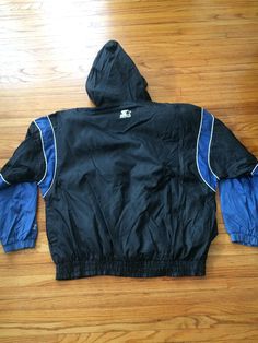 This is an amazing vintage nylon jacket that is ready for college basketball. If you want to look incredible everyday of your life, this is the perfect jacket for you. It will keep you looking great during a fall or spring rain and will make you stand out. There are no rips, holes, stains or smells. Measurements: Pit to pit: 30 inches Collar to bottom front: 24 1/4 inches Collar to bottom back: 27 1/2 inches Sleeve Length (from collar): 33 1/4 inches Size on tag: XL Sporty Nylon Varsity Jacket With Long Sleeves, Casual Nylon Varsity Jacket For Streetwear, Casual Windbreaker For College Sports Season, Sporty Windbreaker For College Sports Season, 90s Style Hooded Outerwear For College, Throwback Hooded Sports Windbreaker, Hooded Throwback Sports Windbreaker, Throwback Hooded Windbreaker For Sports, Hooded Throwback Windbreaker For Sports