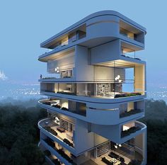 an apartment building with balconies and plants on the balconys at night time