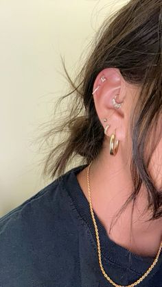 a woman with ear piercings on her ears