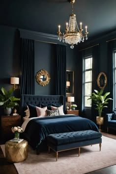 a bedroom with dark blue walls, gold accents and a chandelier hanging from the ceiling