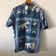 Men’s Hawaiian Shirt Cultural Hawaiian Performing Arts Brand Reyn Spooner Size Large Tailored In Hawaii Multi Color Blue With Ivory Style Short Sleeve With Front Pocket Button Down Front Hawaiian Musician Ocean Design With Tribal Tattoo Print Measurements 25” Underarm To Underarm 27.5” Neck To Hem In Front 30” Collar To Hem In Back Aloha Shirt Excellent Condition Blue Cotton Hawaiian Shirt, Blue Casual Shirt With Vintage Print, Blue Printed Short Sleeve Cotton Shirt, Casual Blue Shirt With Vintage Print, Blue Hawaiian Shirt With Vintage Print, Classic Relaxed Fit Hawaiian Cotton Shirt, Fitted Cotton Hawaiian Shirt With Print, Classic Relaxed Fit Cotton Hawaiian Shirt, Classic Blue Shirt With Graphic Print