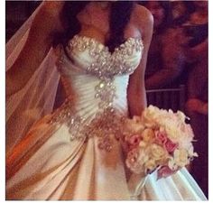 a woman in a wedding dress holding a bouquet