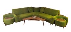 a green couch and some tables in a room